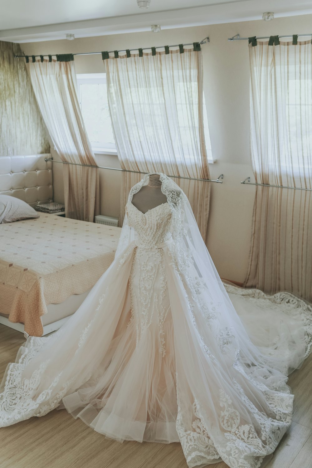 Ball gown laid out with a long veil
