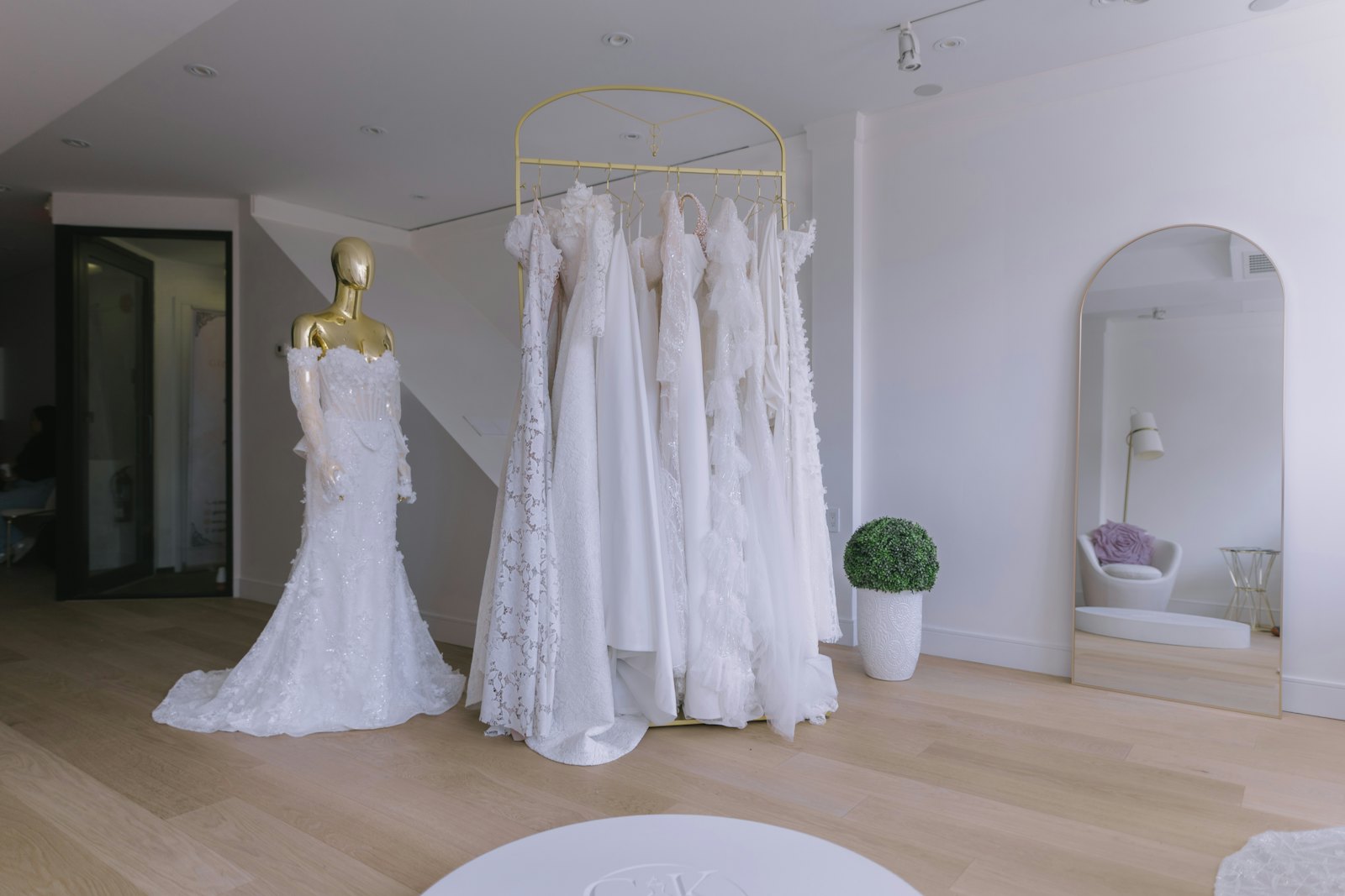 Row of white gowns in the boutique