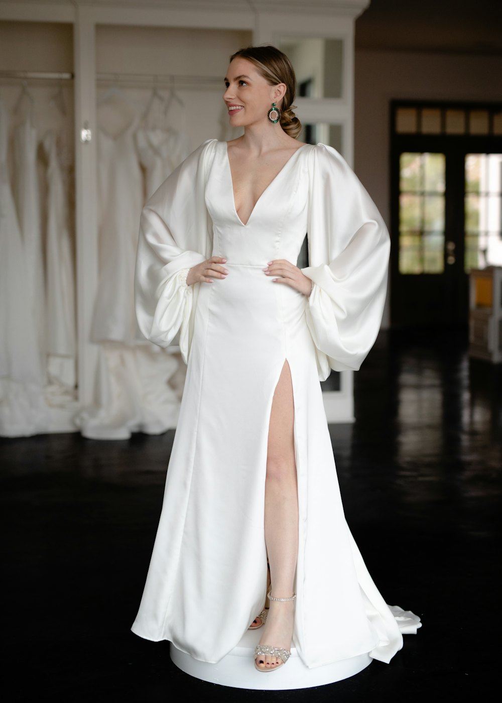 Bride in a satin gown with bishop sleeves