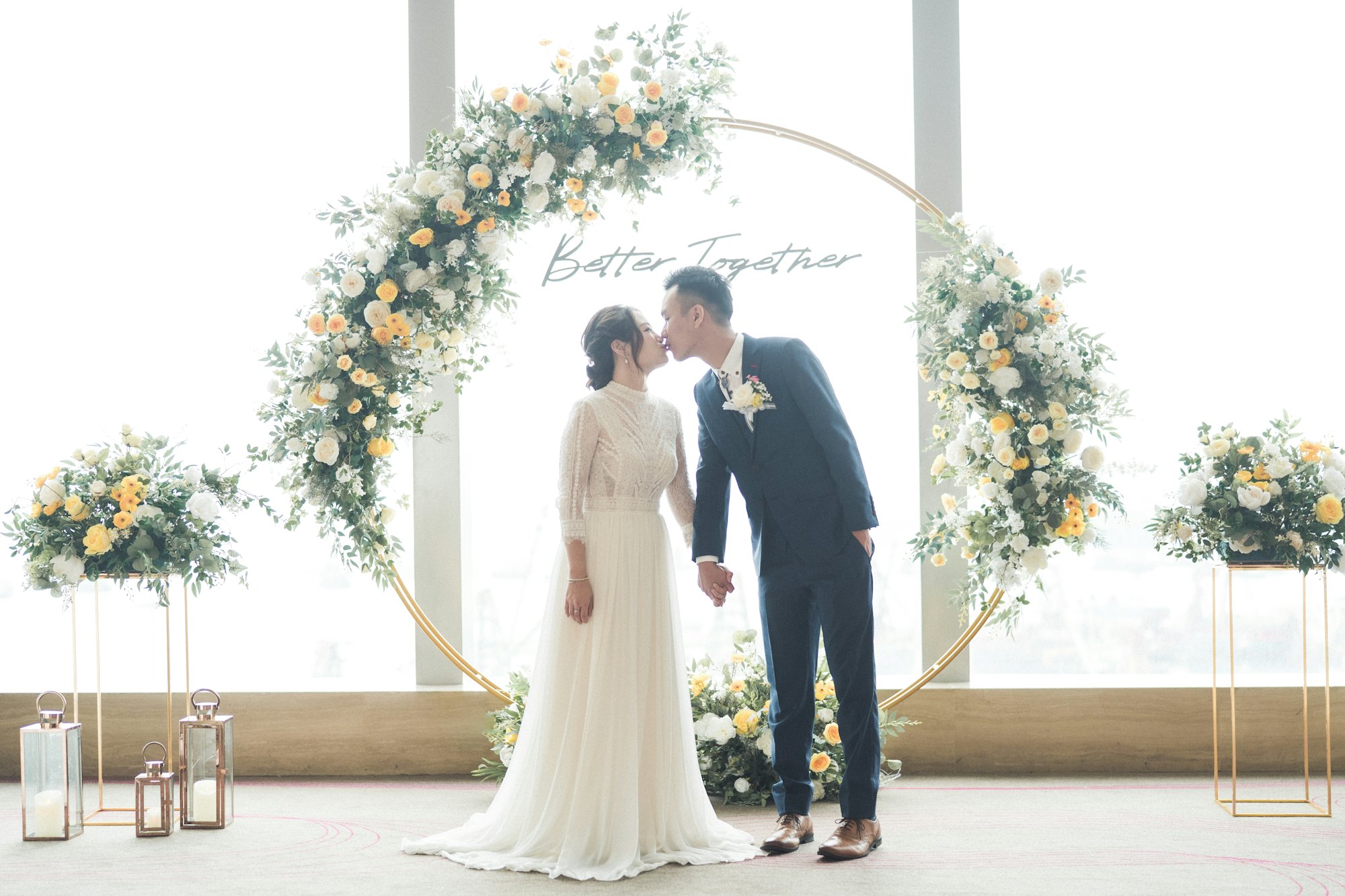 Couple under a floral arch